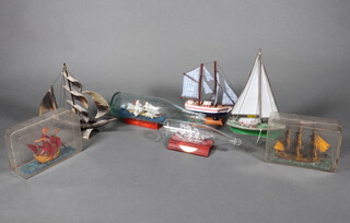 A modern polychrome ship in a bottle, a blown glass ditto and 5 other models 