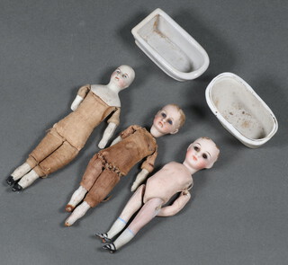 Three miniature porcelain headed dolls with articulated limbs 13cm x 3cm, together with 2 porcelain dolls house baths  