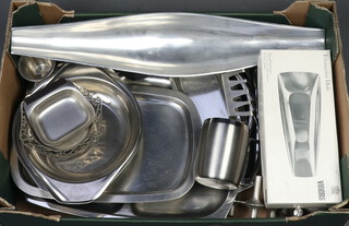 A collection of stainless steel trays and other metal wares 