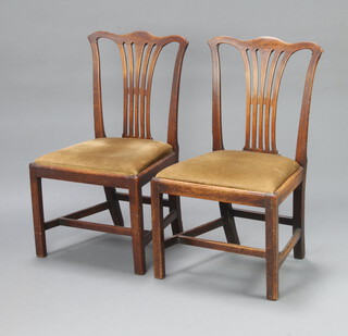 A pair of 19th Century Hepplewhite style mahogany slat back dining chairs with upholstered drop in seats, raised on square supports with H framed stretchers 90cm h x 53cm w x 43cm (frames loose, old repair to 1) 