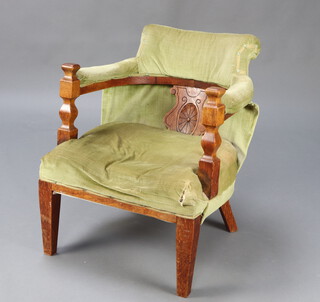 A Victorian beech framed tub back chair upholstered in green material, raised on square tapered supports 70cm h x 64cm w x 59cm d (seat 33cm x 44cm, frame slightly loose) 