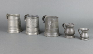 An 18th/19th Century pewter pint tankard marked TV Doile Tower Inn Ripe, 1 other marked with a Crown XX, James Yates a pewter pint tankard (some corrosion and dents), a quarter baluster measure and 1 other