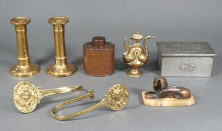 A pewter box with hinged lid, a pair of brass curtain tie backs, pair of candlesticks etc  