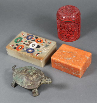 An Indian inlaid specimen marble box with floral pattern to the top 4cm x 15cm x 10cm, a pink veined hardstone box 5cm x 11cm x 8cm, bronze trinket box in the form of a tortoise 4cm x 15cm x 8cm and a lacquered jar and cover 11cm h 