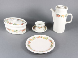 A Wedgwood Quince pattern coffee, tea and dinner service comprising coffee pot and lid, teapot and lid, 1 large tea cup, 9 small mugs, 9 saucers, salt, pepper, 3 egg cups, mustard pot and cover, 3 dishes and covers, a milk jug, sauce boat, sugar bowl, 5 small plates, 6 medium plates, 8 dinner plates and 6 soup bowls  