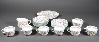 A Haddon Hall part tea set comprising 6 tea cups, 6 saucers, 6 small plates, 1 large plate, a sauce boat and sugar bowl 