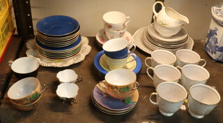A Susie Cooper Azalea pattern part tea set comprising 6 tea cups (1 cup cracked), sugar bowl, 6 saucers, 5 small dishes, a serving dish and milk jug together with other minor decorative tea ware 