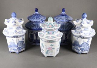 A pair of modern Chinese blue and white hexagonal vases and covers decorated with flowers 30cm, a pair of circular ditto 30cm and 1 other 20cm 