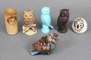 A collection of carved wood, painted and composition figures of owls 