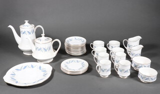 A Royal Standard Trend Pattern tea and coffee service comprising teapot, coffee pot, cream jug, milk jug, 2 sugar bowls, 12 saucers, 5 small plates (1 a/f), sandwich plate, 4 tea cups, 4 coffee cups (1 a/f) and 2 part tea services 