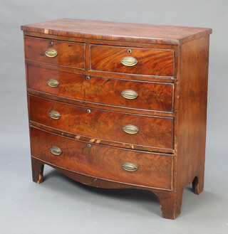 A 19th Century mahogany bow front chest of 2 short and 3 long drawers, raised on bracket feet 101cm h x 108cm w x 46cm d (some veneers missing in places) 
