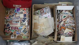 A quantity of GB and World stamps on paper contained in a plastic crate