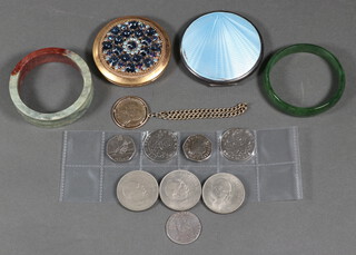 A silver and enamelled compact (bruised), 1 other, 5 commemorative coins, 2 "jade" style bangles and 2 plaques  