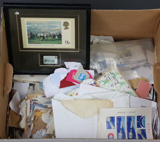 A collection of GB and world stamps on paper, in a cardboard box 