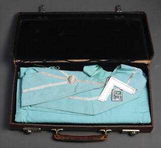 Two leather cases containing a collection of Masonic regalia comprising 2 Past Masters aprons, collar and collar jewel, 3 Royal Arch aprons and a Master Masons apron