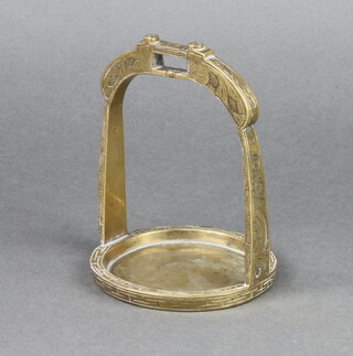 An Eastern polished bronze stirrup 13cm x 9cm 