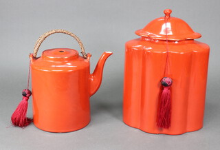 A modern Chinese red glazed oval jar and cover 36cm, ditto teapot 23cm 