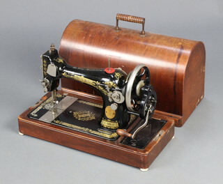 A Singer manual sewing machine no.Y3064793 complete with carrying case 