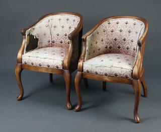 A pair of 1930's beech framed Georgian style tub back armchairs upholstered in pink material raised on cabriole supports 78cm h x 54cm w x 50cm d (seats 30cm x 34cm, requires re-upholstery)
