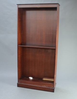 A mahogany finished bookcase fitted adjustable shelves 196cm h x 93cm w x 31cm d 
