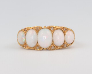 An 18ct yellow gold 5 stone opal and diamond ring size M, 4 grams 