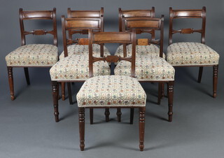 A harlequin set of 7 Georgian mahogany bar back dining chairs with carved mid rails and over stuffed seats, raised on turned supports 82cm x 49cm x 43cm (seat 27cm x 30cm) 
