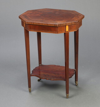 An Edwardian inlaid and crossbanded mahogany 2 tier occasional table, raised on square tapered supports, brass caps and casters, the undertier of serpentine outline 70cm h x 53cm w x 42cm d 