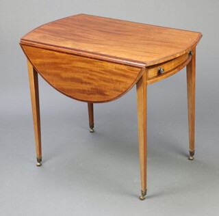 A Georgian oval inlaid mahogany and crossbanded Pembroke table fitted a frieze drawer, raised on square tapered supports, brass caps and casters 69cm h x 85cm w x 52cm d 