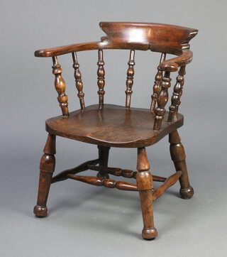 A 19th Century elm and beech smokers bow chair with double H framed stretcher, raised on turned supports 71cm h x 62cm w x 47cm d (seat 23cm x 31cm) 