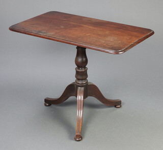 A 19th Century Regency rectangular snap top wine table raised on pillar and tripod base, ending in bun feet 71cm h x 93cm w x 55cm d 