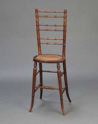 A child's 19th Century faux bamboo ladder back training chair with woven cane seat 94cm h x 31cm w x 22cm d (seat 20cm x 14cm)  