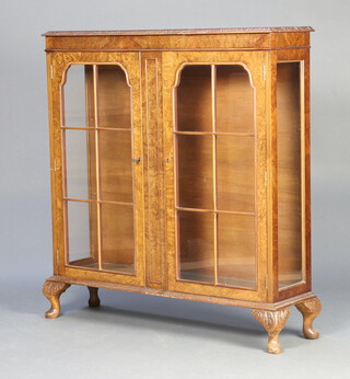 A Queen Anne style walnut display cabinet fitted adjustable shelves enclosed by astragal glazed panelled doors, raised on cabriole supports 113cm h x 106cm w x 30cm d 
