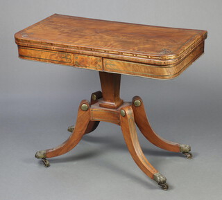 A Regency mahogany inlaid brass D shaped card table raised on a square column and triform base with outswept supports, brass paw feet, 75cm h x 91cm w x 45cm d  