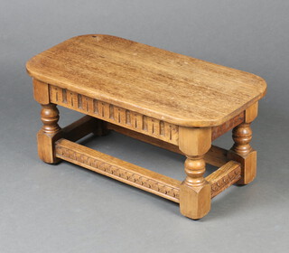 An Ipswich style rectangular light oak coffee table with arcaded decoration, on turned and block supports with box framed stretcher 29cm h x 63cm w x 32cm d 