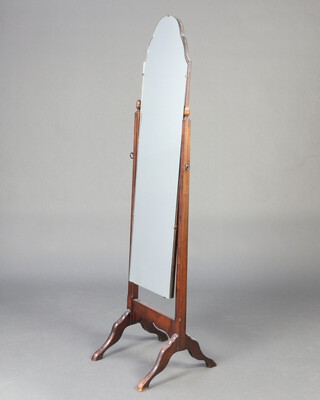 A 1930's arched plate cheval mirror contained in a beech frame with apron finials 156cm h x 45cm w  