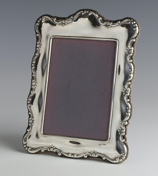 A modern repousse silver photograph frame 24c x 19cm 