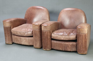 A handsome pair of Art Deco armchairs upholstered in brown leather 76cm h x 95cm w x 84cm d (seat 41cm x 42cm) 