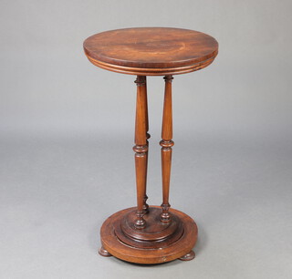A Victorian rosewood circular occasional table raised on 3 turned columns ending in bun feet 81cm h x 46cm diam. 