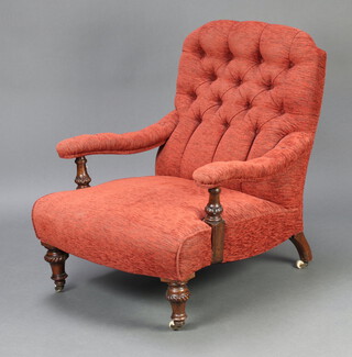 A Victorian open armchair upholstered in terracotta buttoned material, raised on turned supports with ceramic casters  67cm h x 70cm w x 36cm d 