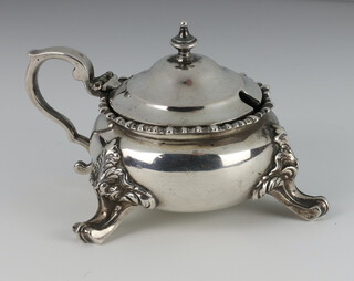 A Victorian silver mustard with egg and dart rim on scroll feet with S scroll handle London 1900, 314 grams 