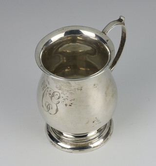 A silver baluster mug with C scroll handle Birmingham 1946, 8cm, 75 grams, engraved monogram 