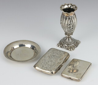 An Edwardian silver cigarette case with engraved decoration, a repousse vase, dish and matchbook holder, weighable silver 138 grams 