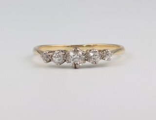 A yellow metal 5 stone diamond ring 1.8 grams, size Q 1/2