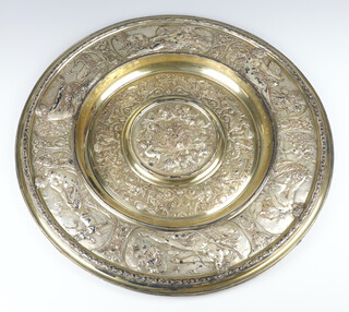 In the manner of Elkington, an impressive Victorian repousse silver plated rosewater dish, the rim decorated with reclining classical figures, the interior with cavorting cherubs and mythical beasts with alternate panels - July, August, September, October, November, December 53cm 
