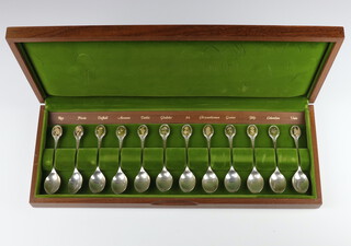 A set of 12 silver Royal Horticultural Society flower spoons by John Pinches, Sheffield 1973, 299 grams, boxed
