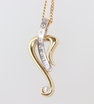 A 14ct yellow gold diamond set pendant on a 9ct chain 44cm, gross weight 4.6 grams