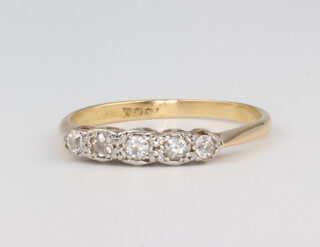 A yellow metal 18ct 5 stone diamond ring, size M, 2 grams