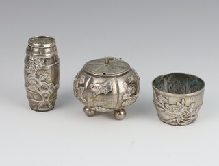 A Chinese silver 3 piece condiment comprising a pumpkin mustard, a barrel pepper and a half barrel salt decorated with flowers and motifs by Luen Hing of Shanghai, circa 1900, 132 grams 