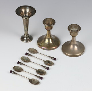 A pair of silver dwarf candlesticks with spread foot Birmingham 1913 9cm together with a ditto weighted spill vase 10cm and 6 silver coffee spoons 