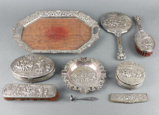 A Dutch silver plated dressing table set comprising hexagonal tray, hair brush, clothes brush, mirror, comb, circular trinket box, oval trinket box and ashtray 